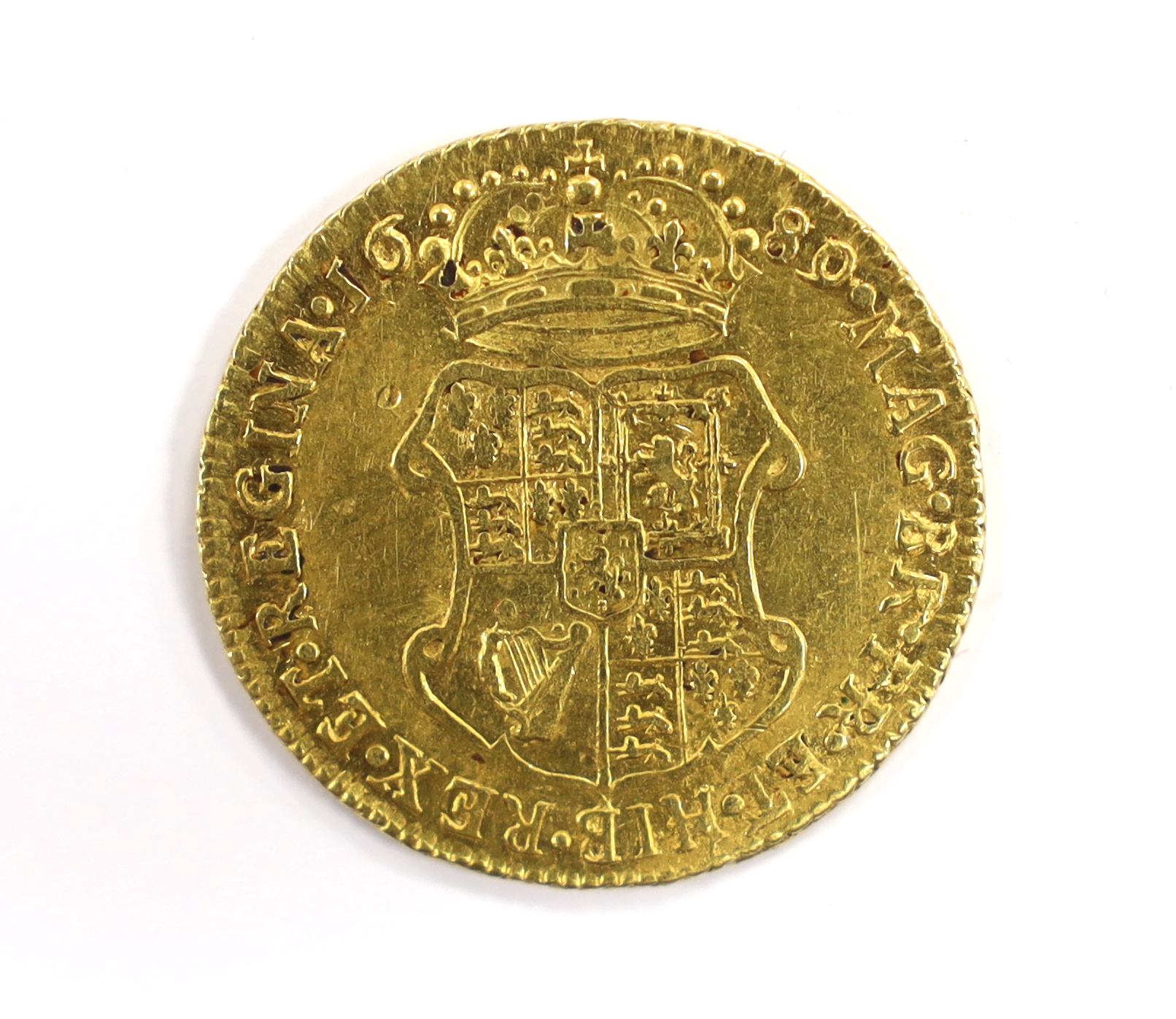 British gold coins - A William and Mary gold guinea, 1689, probably demounted at 12 o’clock, otherwise good Fine (S3426), Provenance bought from Richard Lobel and co Ltd, London, 7th March 1977 for £275